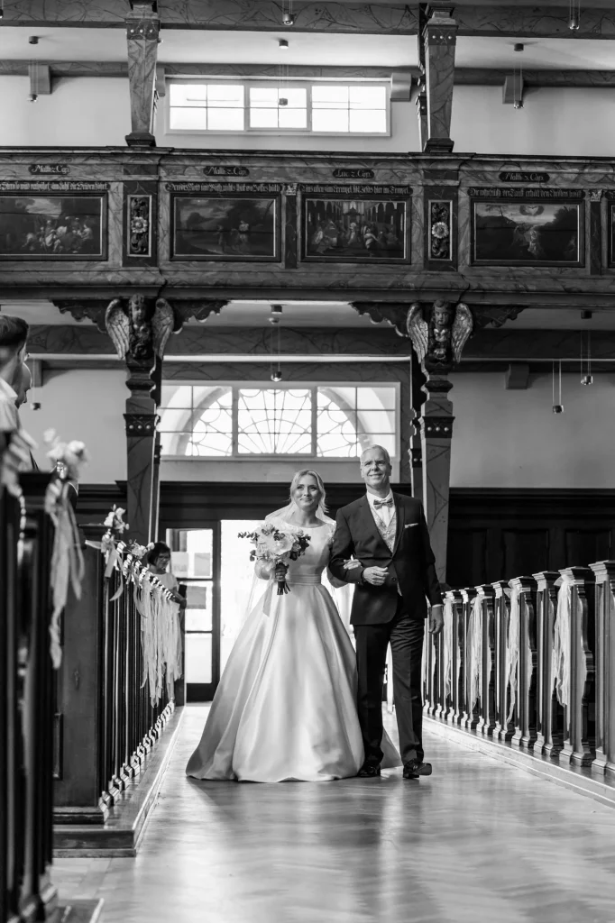 the bride and her father in the church