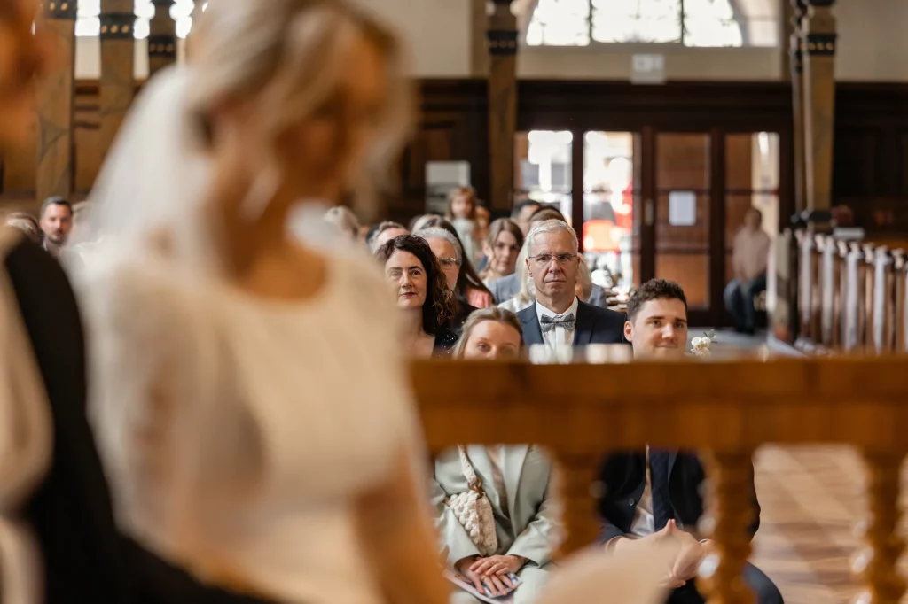 a mometn of the wedding ceremony in the church