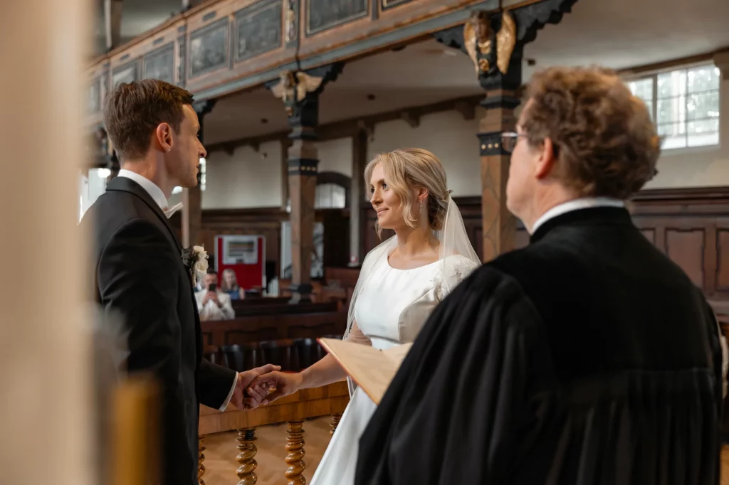the vows of the bride and groom in the church during the wedding ceremony