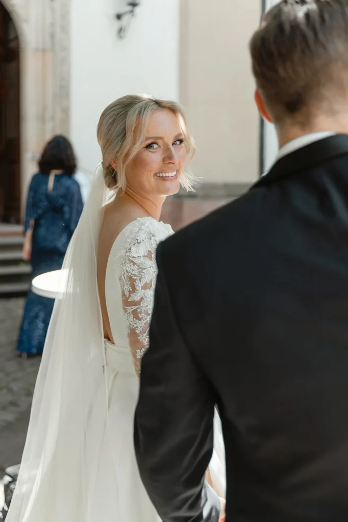 the bride looks to the camera