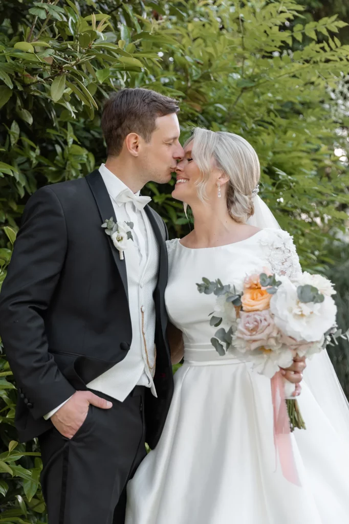 the groom kisses the bride