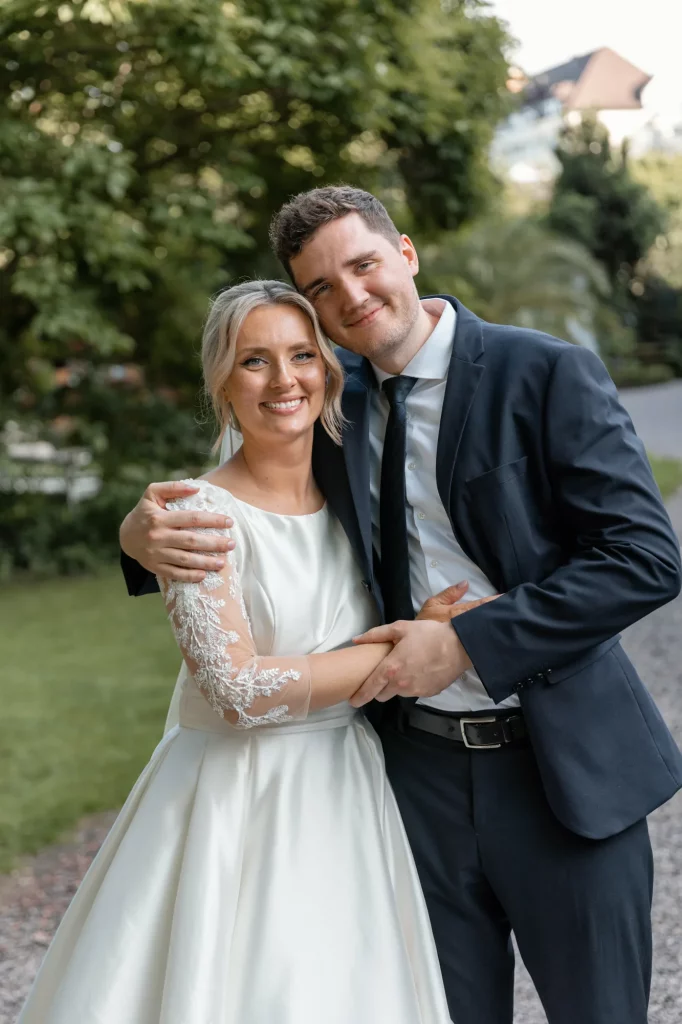 The bride stands with her brother
